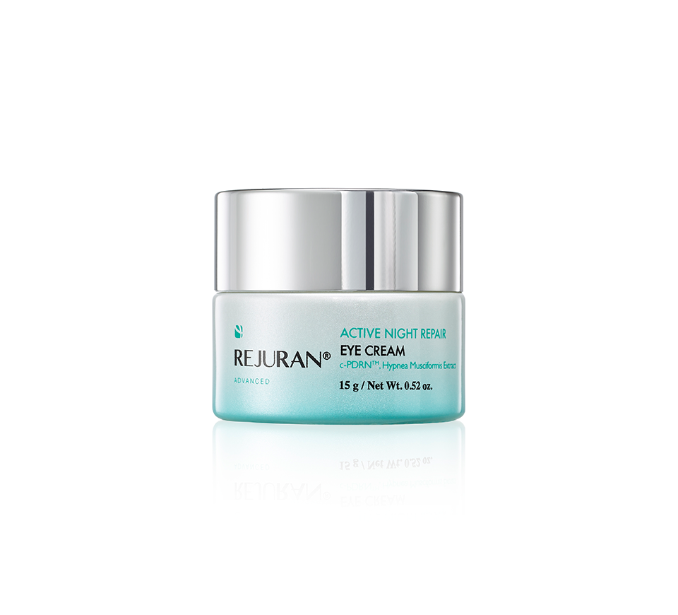 Rejuvenating eye cream jar with silver lid on a white background